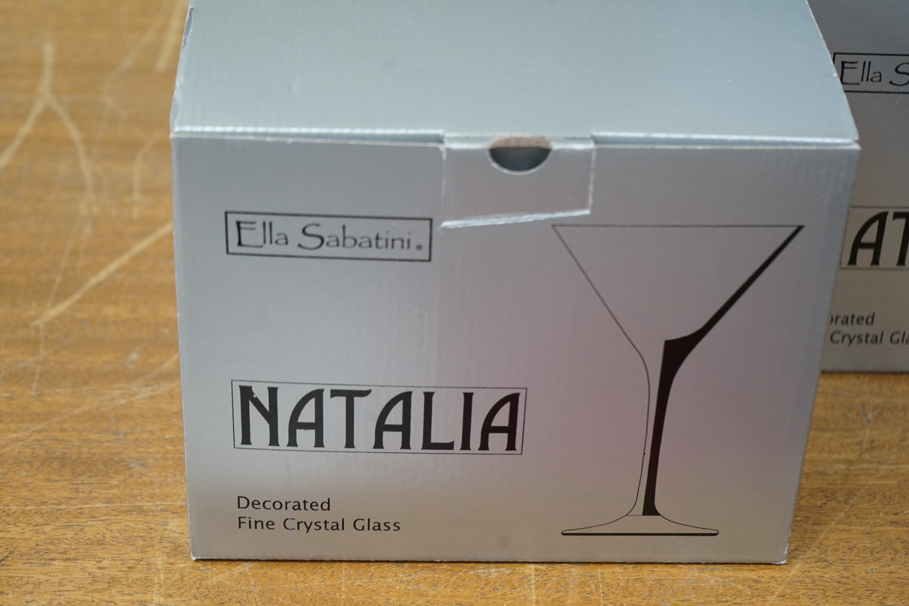 A suite of Ella Sabatini, Natalia fine crystal glasses to include cocktail, flute wine classes, boxed. Condition - good